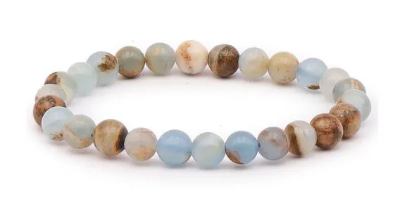 BRACELET CALCITE BLEUE SUR GUANGUE AA BOULE 8MM